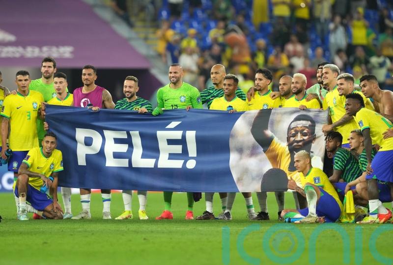 Brazil players display banner in support of Pele after seeing off South Korea