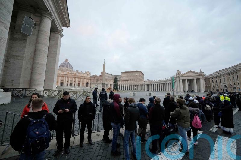 Doors open for thousands to see Pope Benedict&rsquo;s body lying in state at Vatican