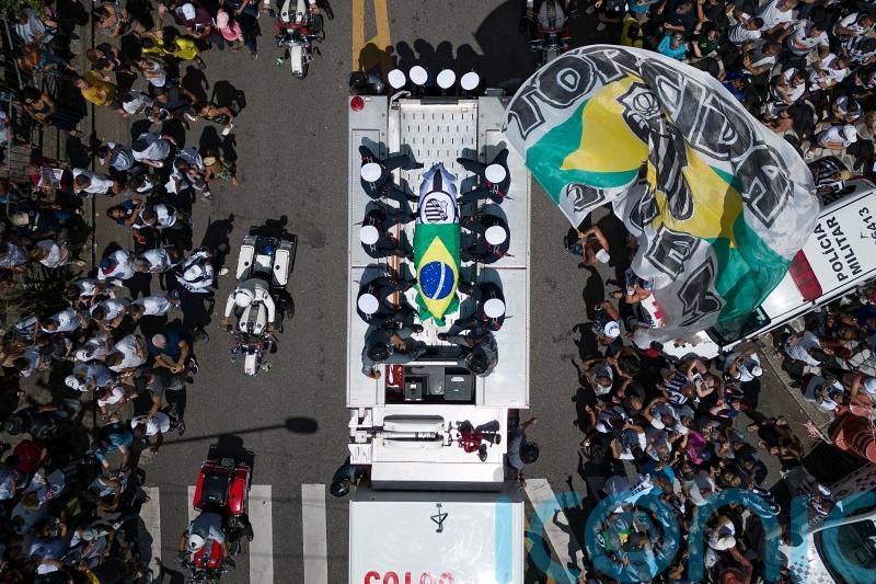 Thousands line streets to bid final farewell to Brazil great Pele