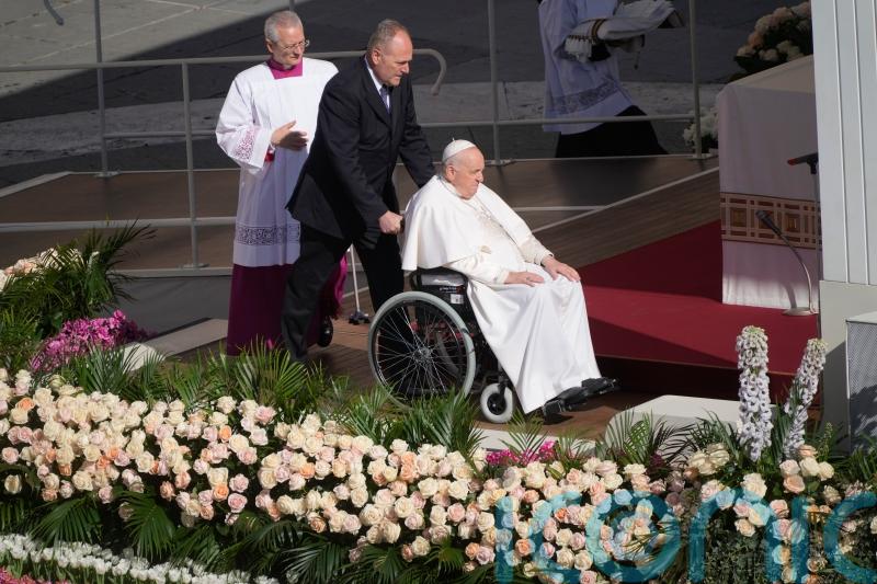 Pope celebrates Easter with big crowd in flower-adorned Vatican square