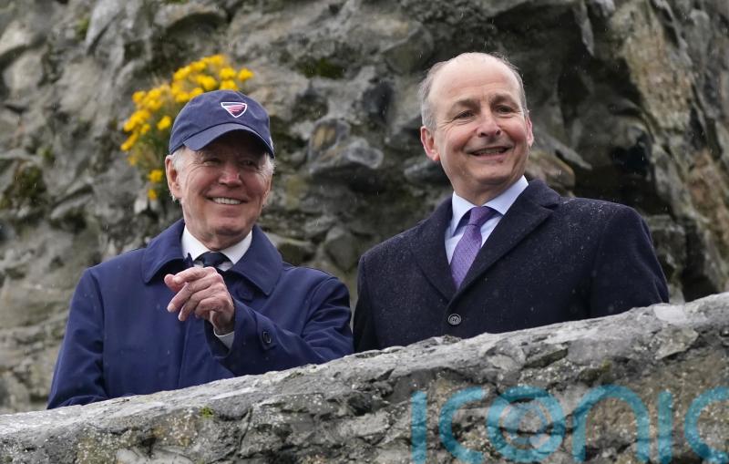 US president cheered by well-wishers waiting in the rain in Carlingford