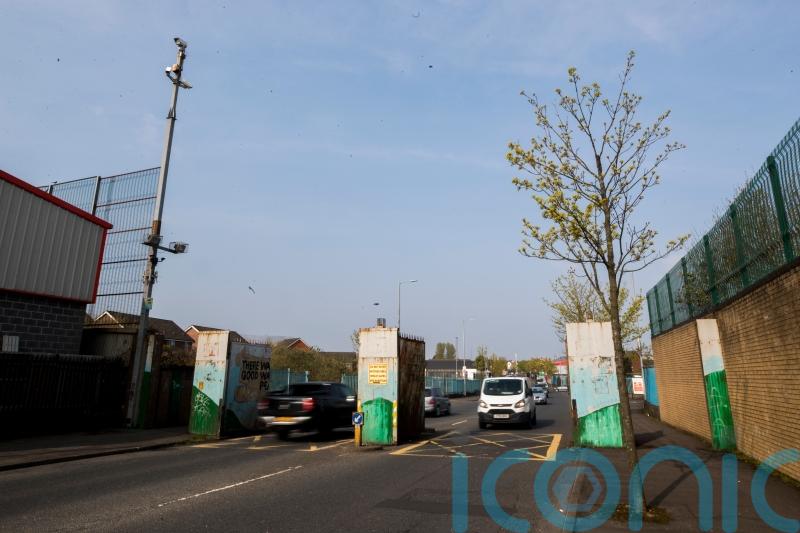 'Walk away and don't get involved' - Youths attack police officers at Belfast peace wall