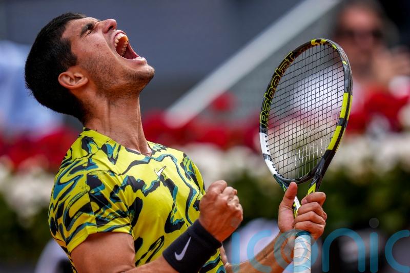 Carlos Alcaraz digs in to avoid shock defeat by Emil Ruusuvuori in Madrid