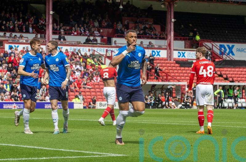 Peterborough book play-off place with victory at Barnsley