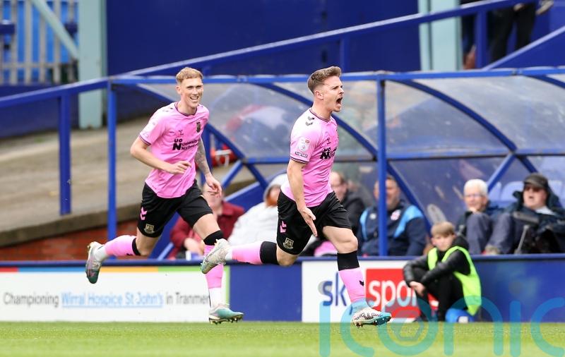 Northampton seal promotion from League Two after victory at Tranmere