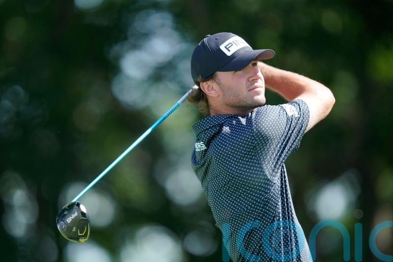 Rookie Austin Eckroat grabs share of lead as Scottie Scheffler falters