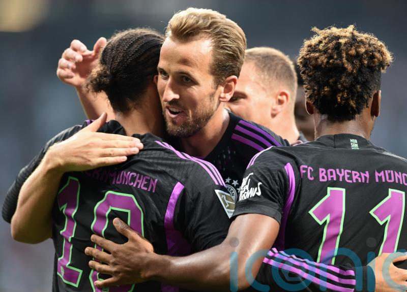 Harry Kane scores on Bundesliga debut as champions Bayern open with big away win