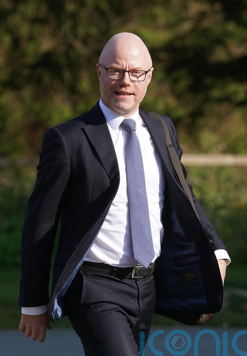 Opposition parties call on Donnelly to return from NY amid spinal surgery review