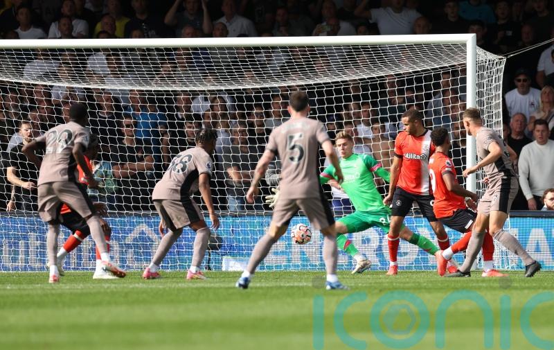 Micky van de Ven scores as 10-man Tottenham go top with win over Luton