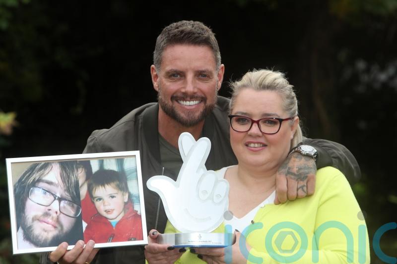 Keith Duffy presents award to founder of autism and suicide prevention charity