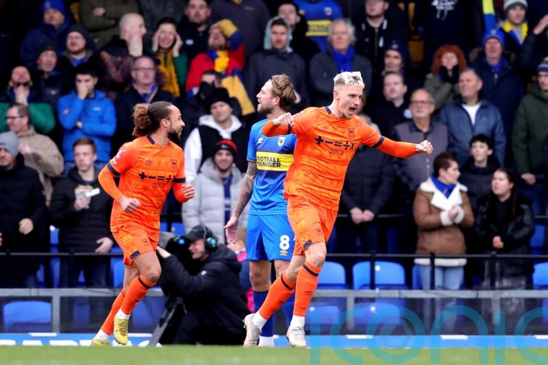 Ipswich beat 10-man AFC Wimbledon to book their place in the FA Cup fourth round
