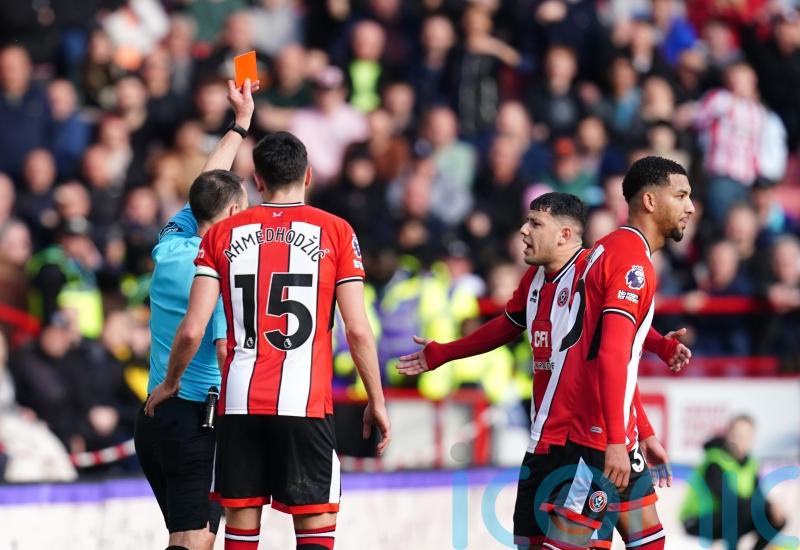 Sheffield United condemn racist abuse sent to Mason Holgate after red card