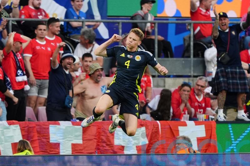 Scotland boost hopes of making it through the group stage with Switzerland draw