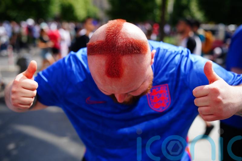 Barber who shaved St George cross into his hair among fans in Berlin