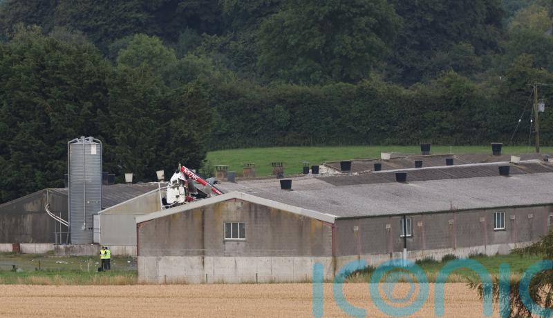 Fatalities feared after helicopter crashes into farm building