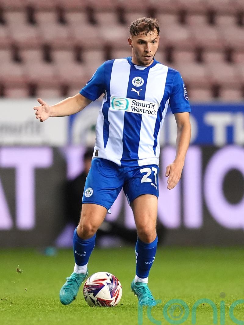 Scott Smith and Jonny Smith send Wigan past 10-man Carlisle in extra time