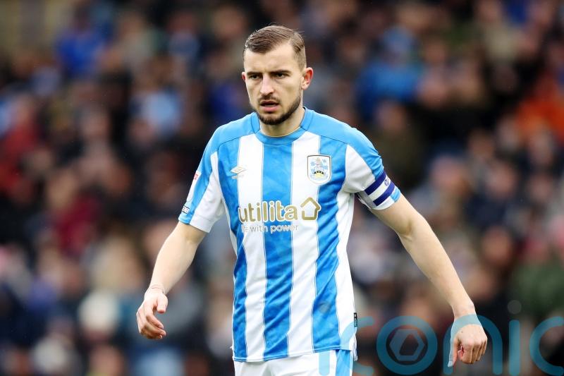 Michal Helik goal sees Huddersfield rescue point at home to bottom side Burton