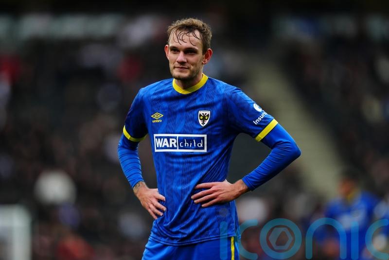 AFC Wimbledon bolster promotion bid with win at relegation-threatened Carlisle