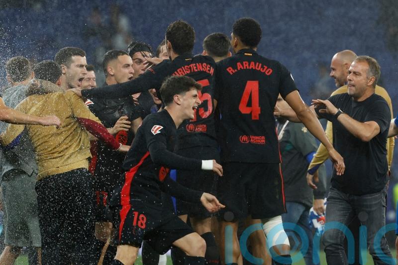 Barcelona clinch LaLiga title with victory at 10-man Espanyol