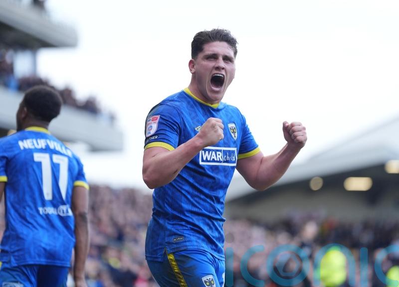 AFC Wimbledon off the mark with win over 10-man Lincoln