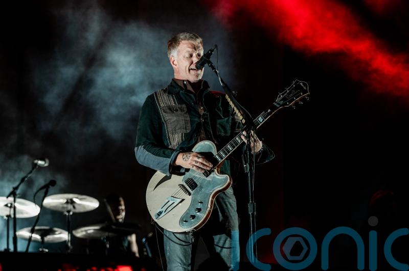 Queens Of The Stone Age headline festival rocked by controversy
