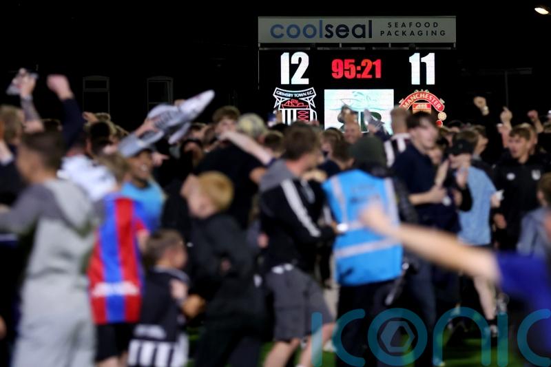 Grimsby fined by EFL for fielding ineligible player in cup win over Man Utd